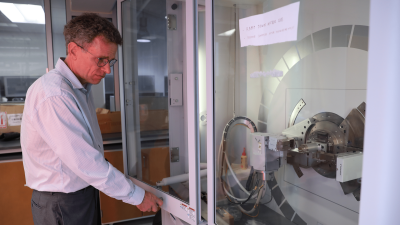 Mitzi with an X-ray diffraction tool used to study the structure and quality of potential new materials for energy-related applications. 