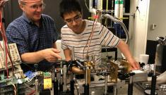 Duke professor Henry Everitt and then MIT graduate student Fan Wang with the first version of a tunable terahertz laser.